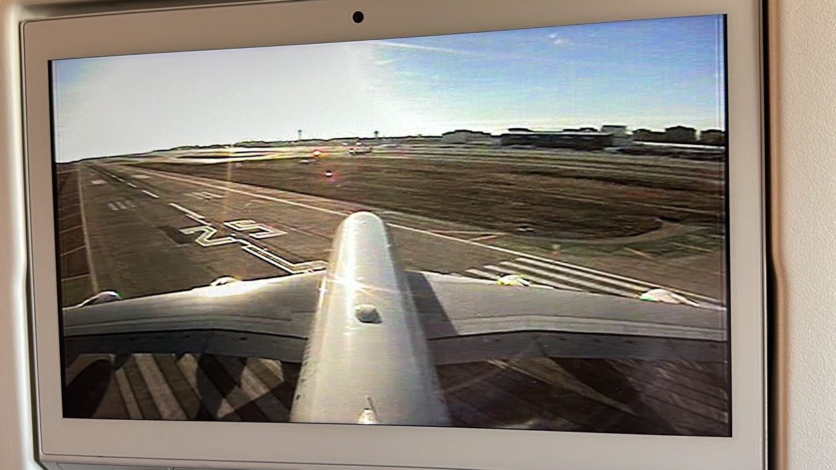 a computer screen showing an airplane wing