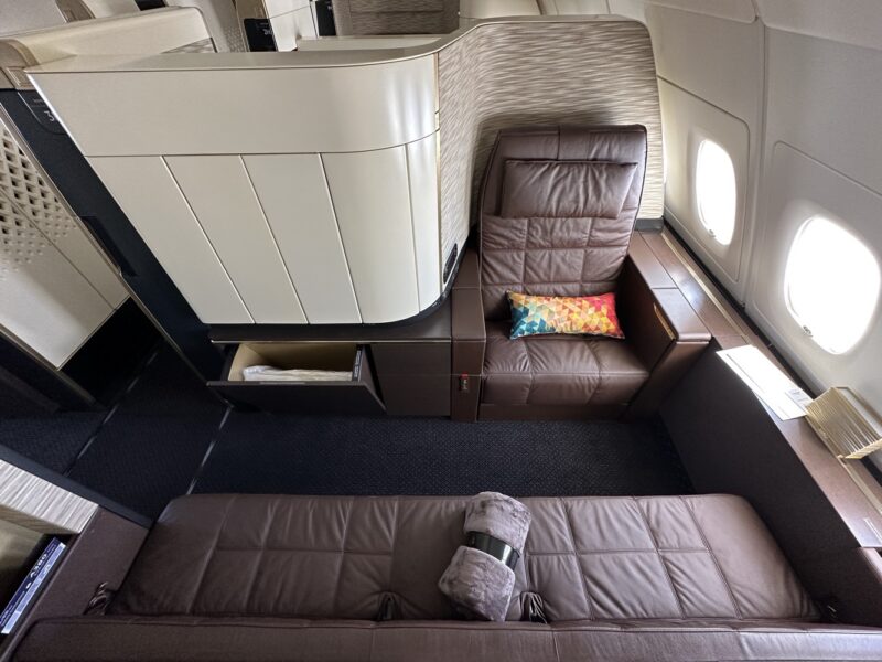 a seat and a couch in a plane