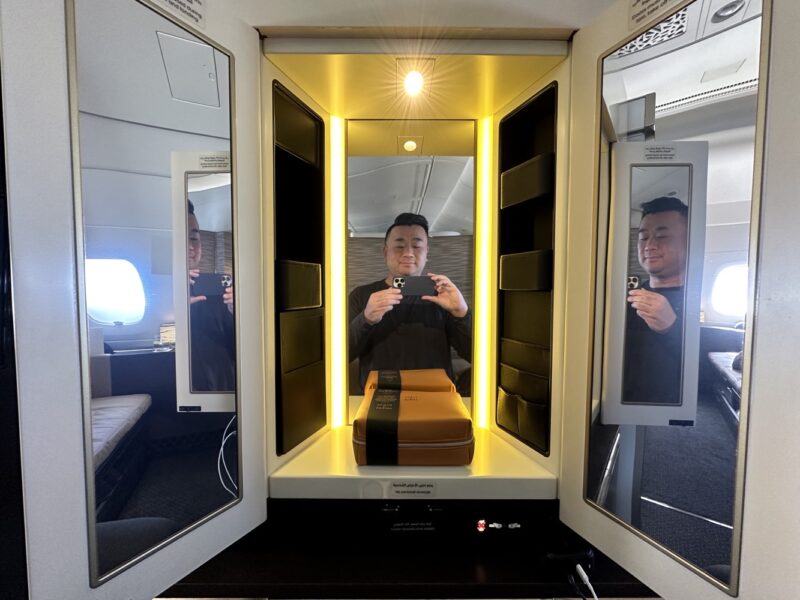 a man taking a selfie in a booth