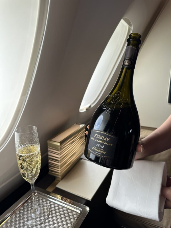 a bottle of champagne and a glass of champagne