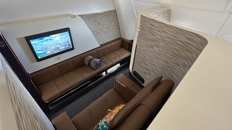 a couch and a television in a plane