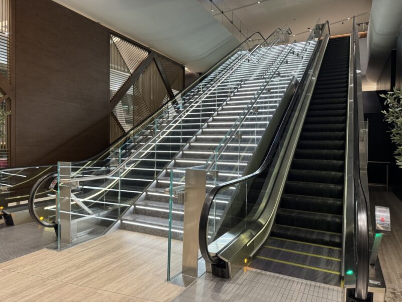 a escalator with glass railings