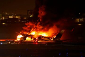 a plane on fire at night