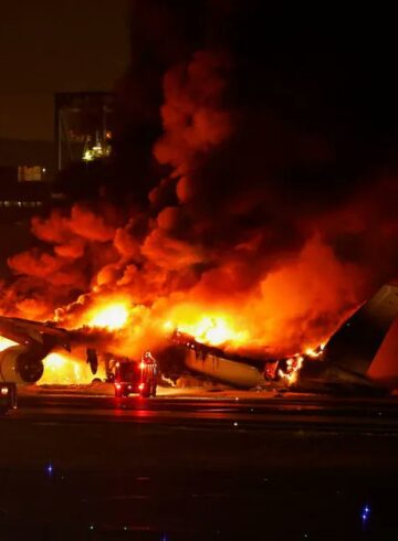 a plane on fire at night