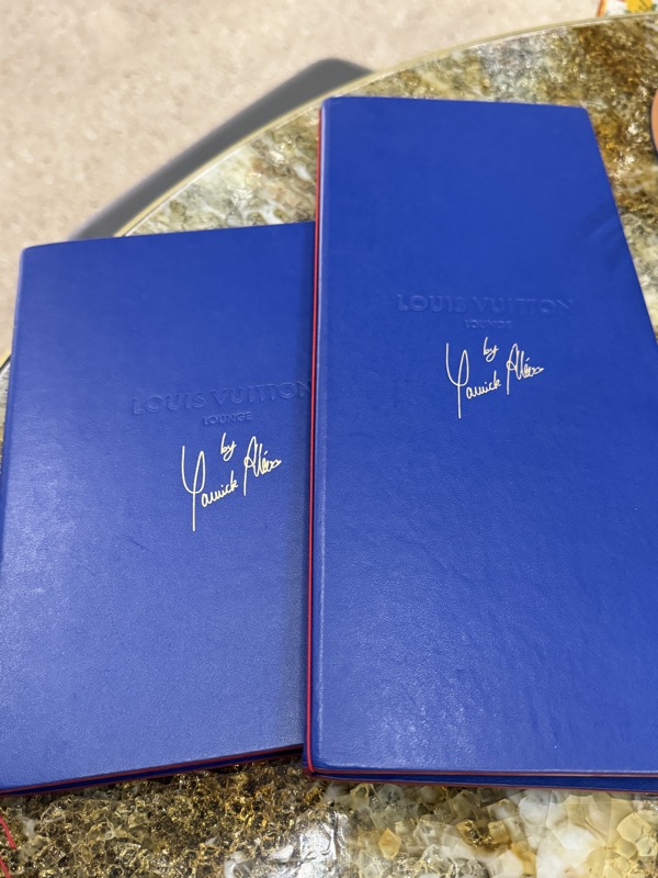a pair of blue books on a table