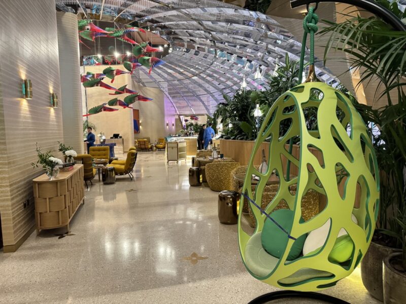 a green chair in a lobby