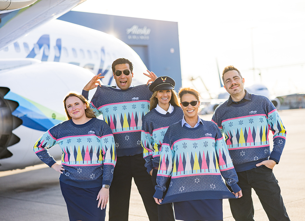 a group of people wearing matching sweaters and sunglasses