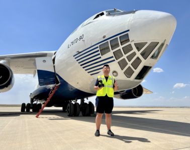 a man standing in front of a plane